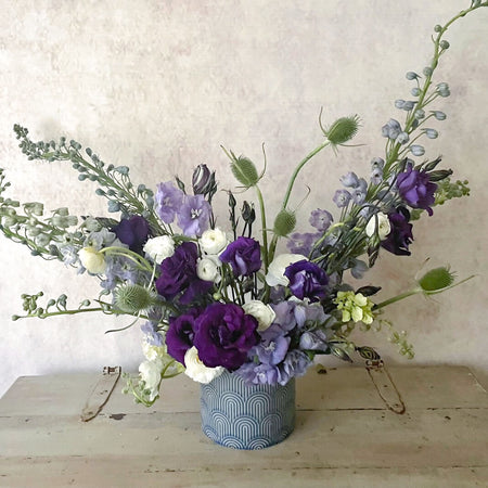 Paige flower arrangement Ranunculus Thisle dephilinum purple lisianthus